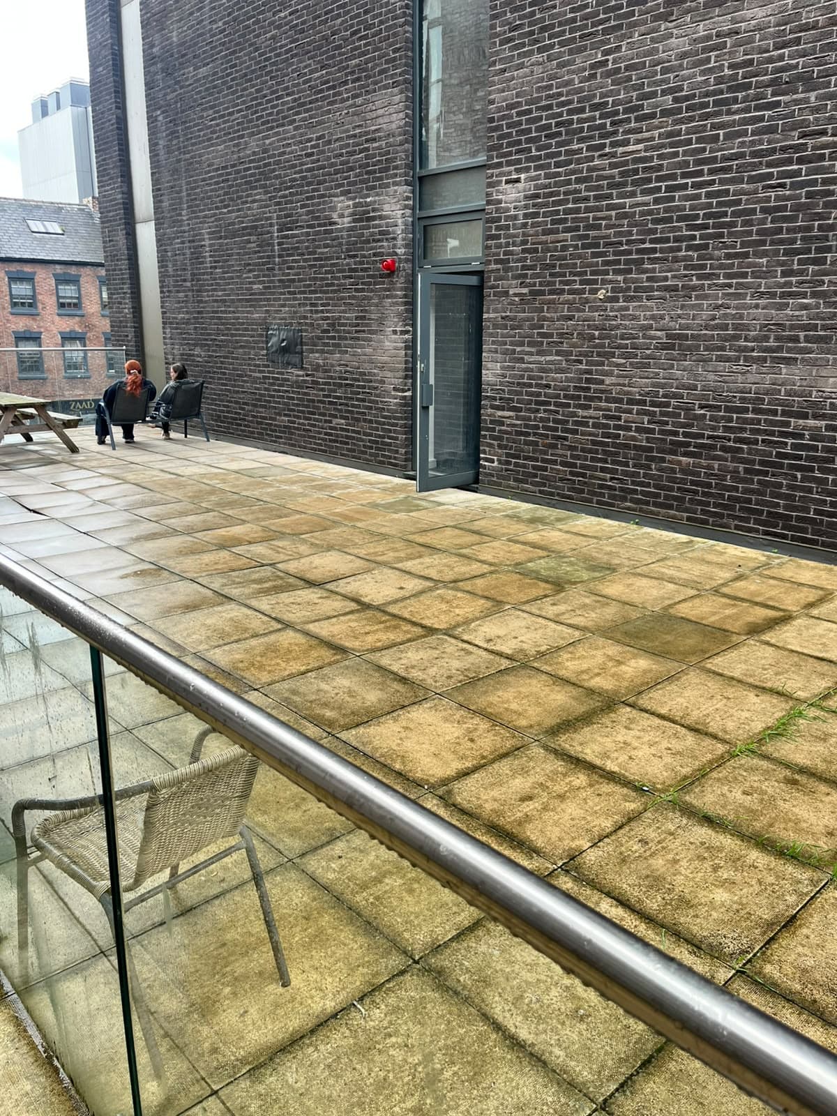 Second balcony area before pressure washing at One Wolstenholme Square