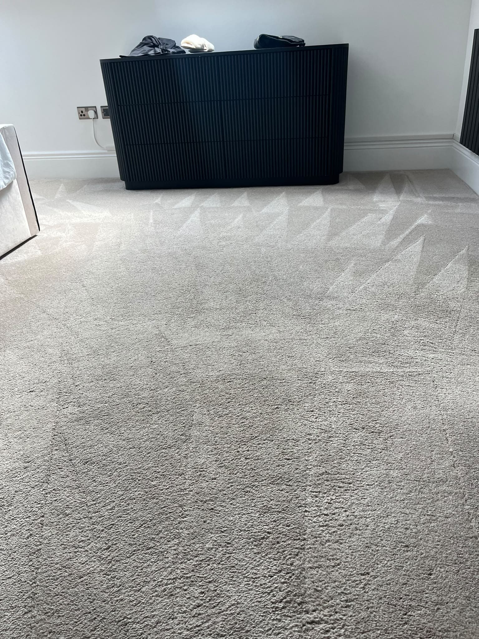 Freshly cleaned living room carpet after professional carpet cleaning