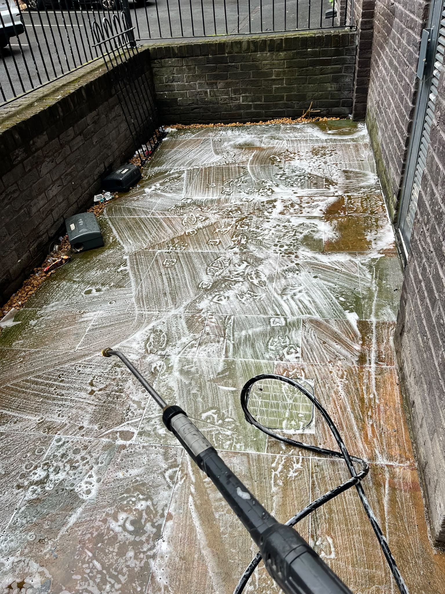 Pressure washing in progress at One Wolstenholme Square