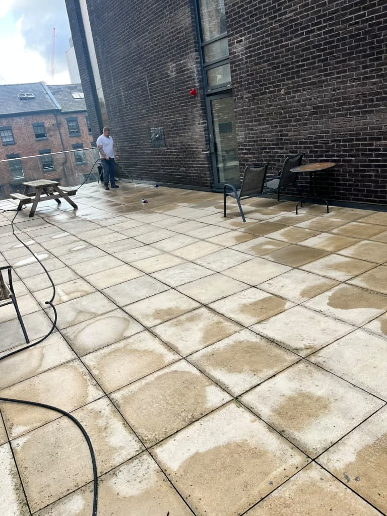 Operative pressure washing exterior paving at One Wolstenholme Square
